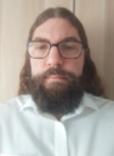 a portrait photograph of Adam Taylor
